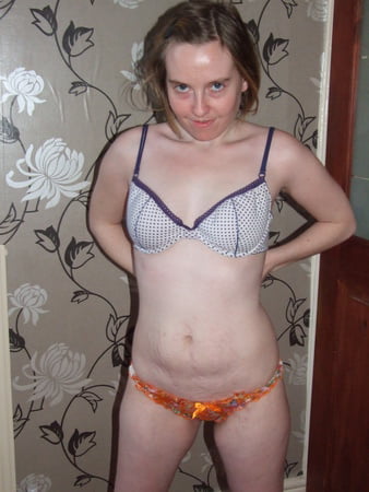 cute blonde posing in jeans and shirt         