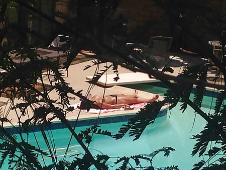 My neighbor Elle sunbathing topless in thong