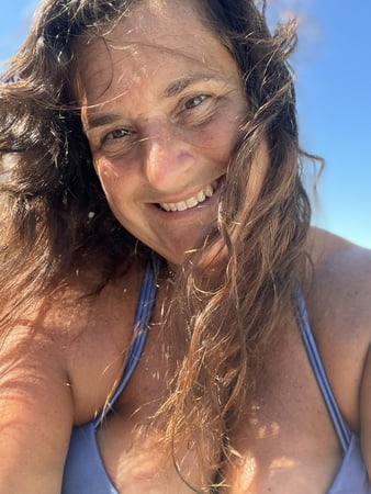 sunning in sexy purple bikini         