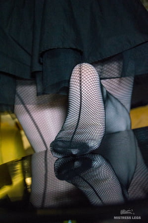 high heels and white pantyhose with black fishnets         
