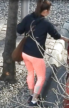 candid young mom in orange leggings