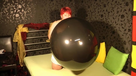 black balloon golden heels red fingernails         