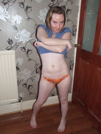 cute blonde posing in jeans and shirt         