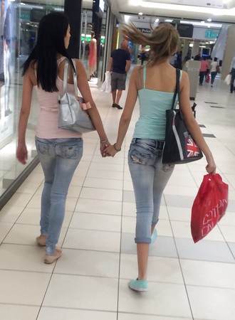 Sexy mom and teen in the mall