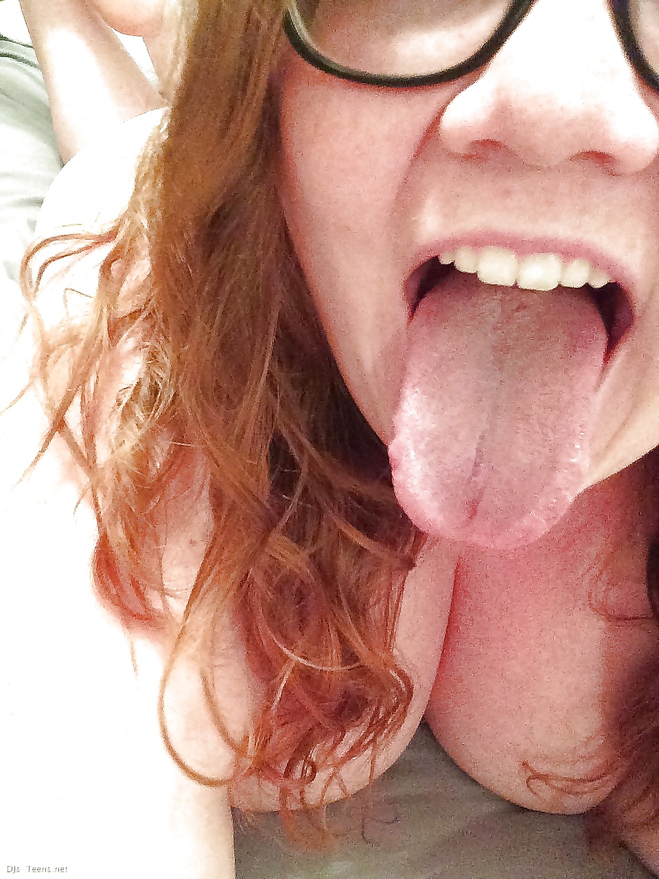 Tongue out naked girl