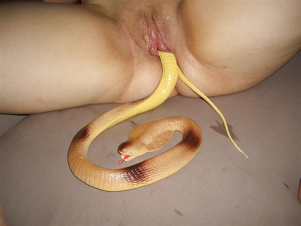 Live eel being shoved into an amateur sluts open pussy
