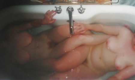 Wife in bathtub right before Lesbian action.